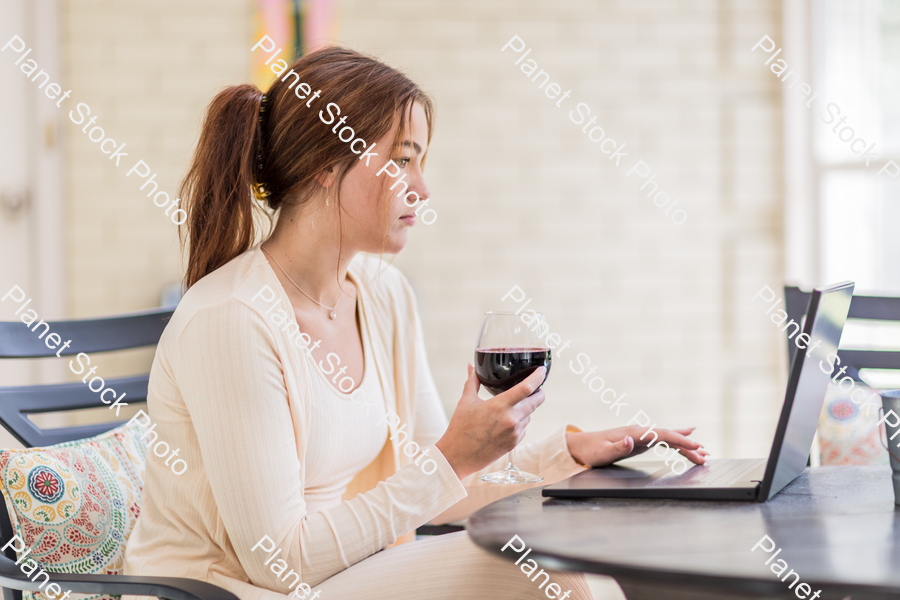 A young lady enjoying daylight at home stock photo with image ID: 6c93df8a-d2c5-4141-9a4d-cc4becb925c2