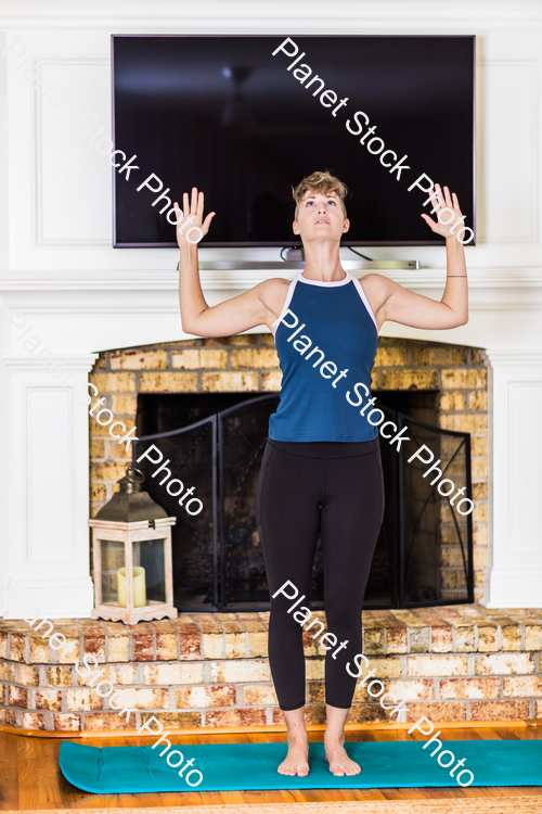 A young lady working out at home stock photo with image ID: 6d4e8737-0c50-4160-8e89-2804824eb9b6