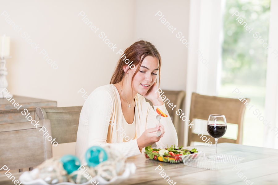 A young lady having a healthy meal stock photo with image ID: 6e6222ce-8de5-446e-ae39-a78c0d2fcfc9