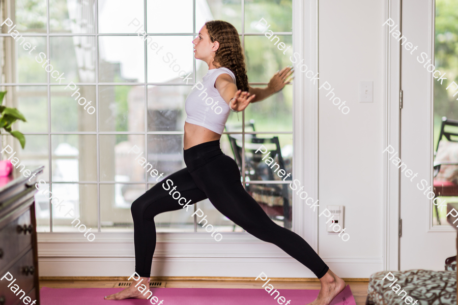 A young lady working out at home stock photo with image ID: 704e1a4f-eb7f-46d4-9534-0660d13b95a3