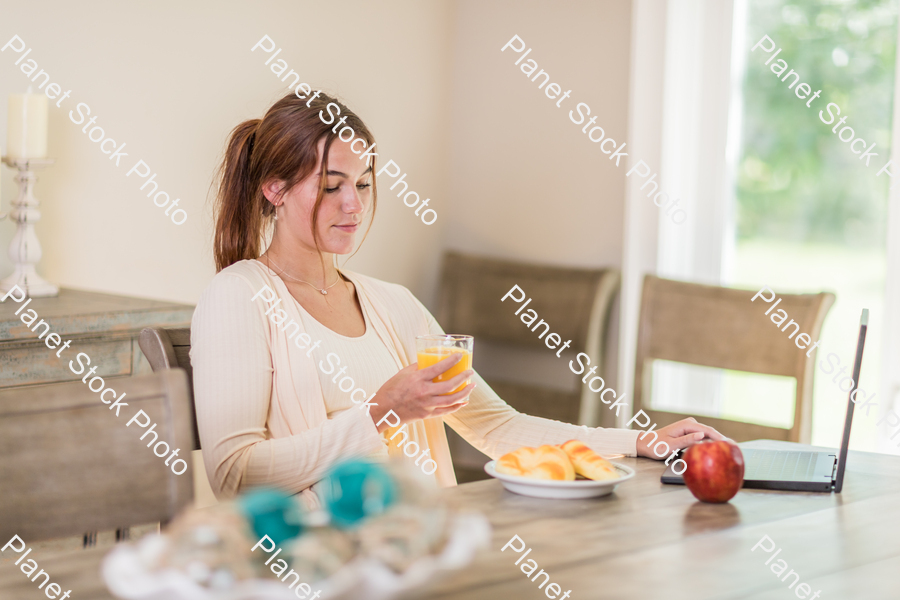 A young lady having a healthy breakfast stock photo with image ID: 70adc3d6-7880-4b87-a049-dfbad1d5a087