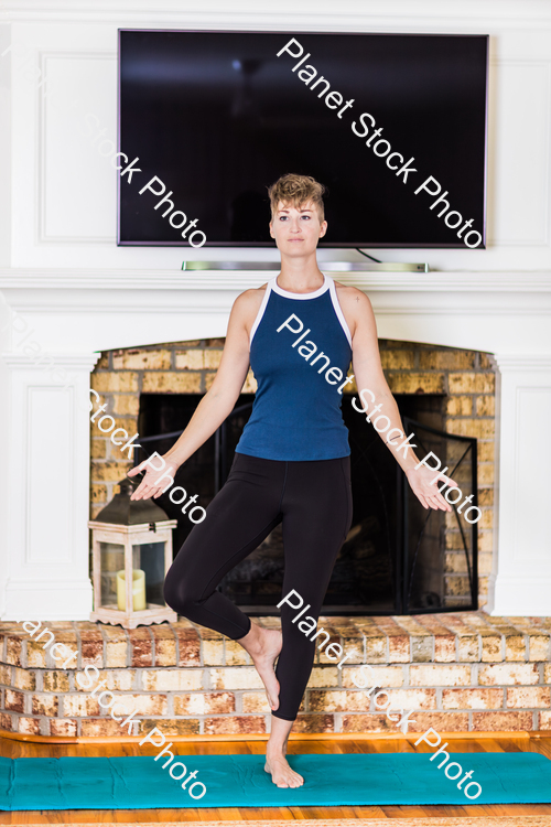 A young lady working out at home stock photo with image ID: 71470526-c381-4622-a4df-f4c269de80f1