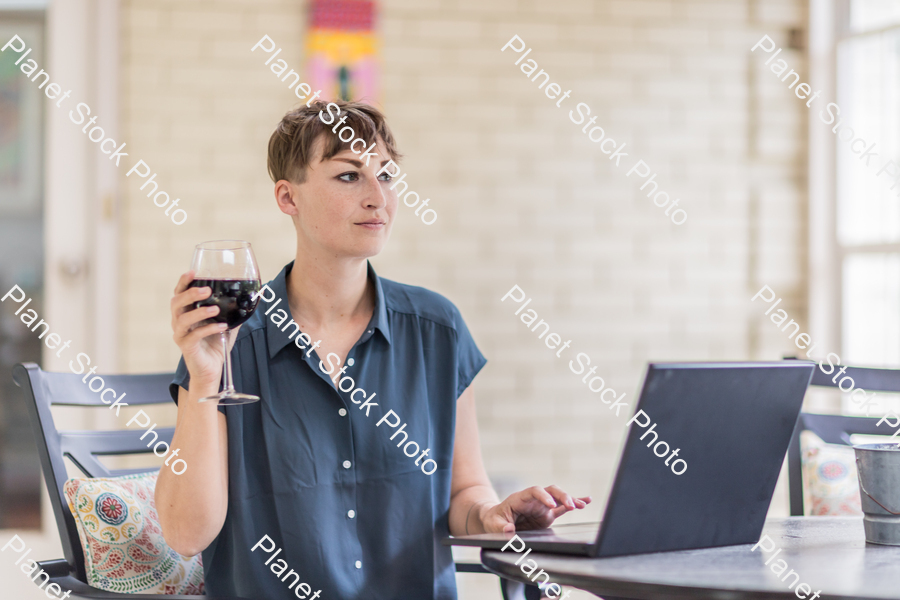 A young lady enjoying daylight at home stock photo with image ID: 7287e1db-5a95-4863-b556-b9d088f0955d