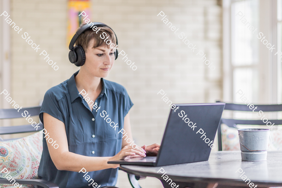 A young lady enjoying daylight at home stock photo with image ID: 7616281f-679f-4dbc-b21a-367a72006e99