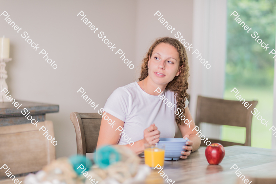 A young lady having a healthy breakfast stock photo with image ID: 7704eb81-e0c1-4cb4-92b8-22e9066bd731