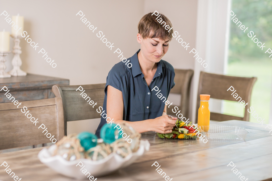 A young lady having a healthy meal stock photo with image ID: 7a6c5949-4d84-42d9-a526-953d562d6fc0