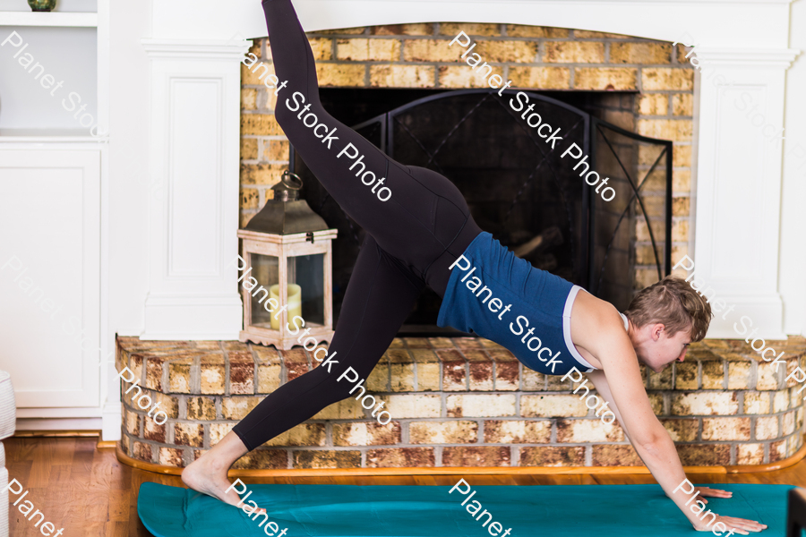 A young lady working out at home stock photo with image ID: 7b8f249f-78b1-4fa2-a941-d55f69ff736d