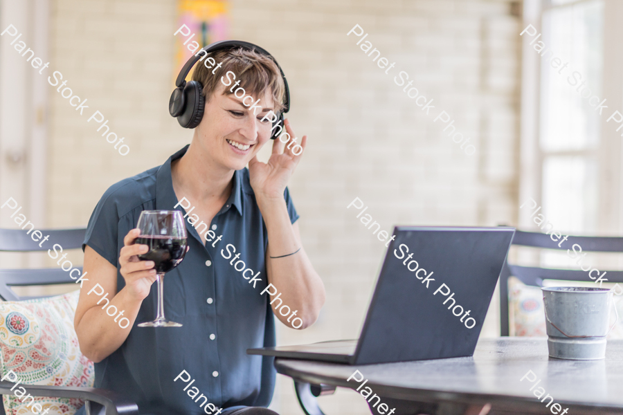 A young lady enjoying daylight at home stock photo with image ID: 7c13b5dd-c8aa-4155-b0b8-ae532c5d7db9