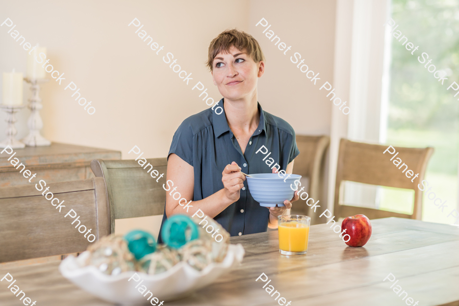 A young lady having a healthy breakfast stock photo with image ID: 7c485e92-2d73-4fc8-af33-0571d9d4007a