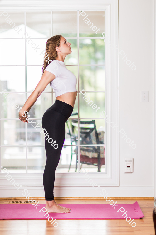 A young lady working out at home stock photo with image ID: 7d7a6a88-3401-4314-b7eb-380058a65791