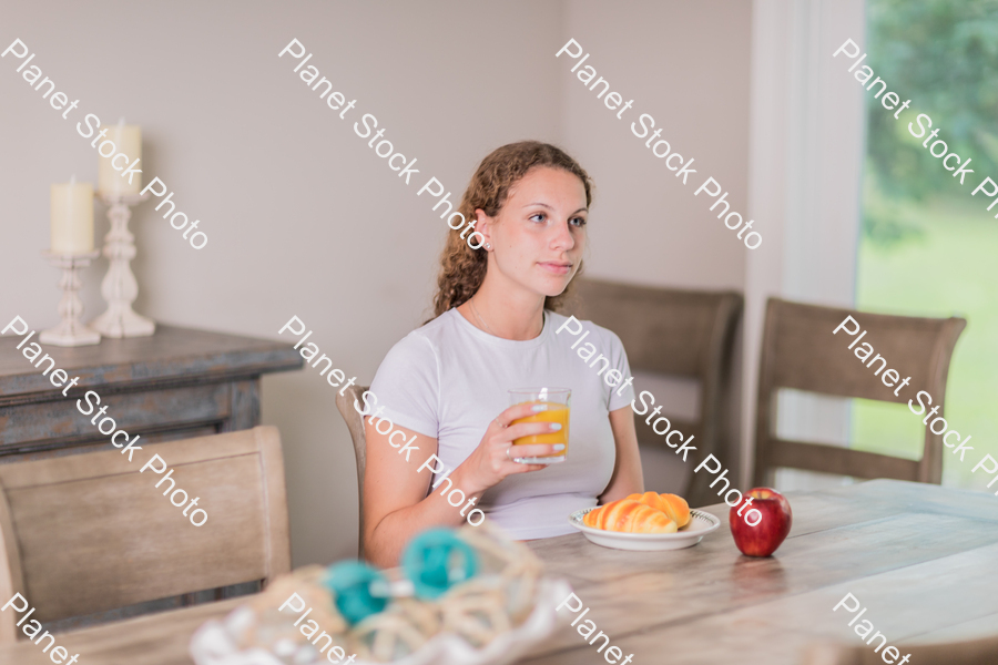 A young lady having a healthy breakfast stock photo with image ID: 7db643a4-df11-469d-83c1-da60f62c6456