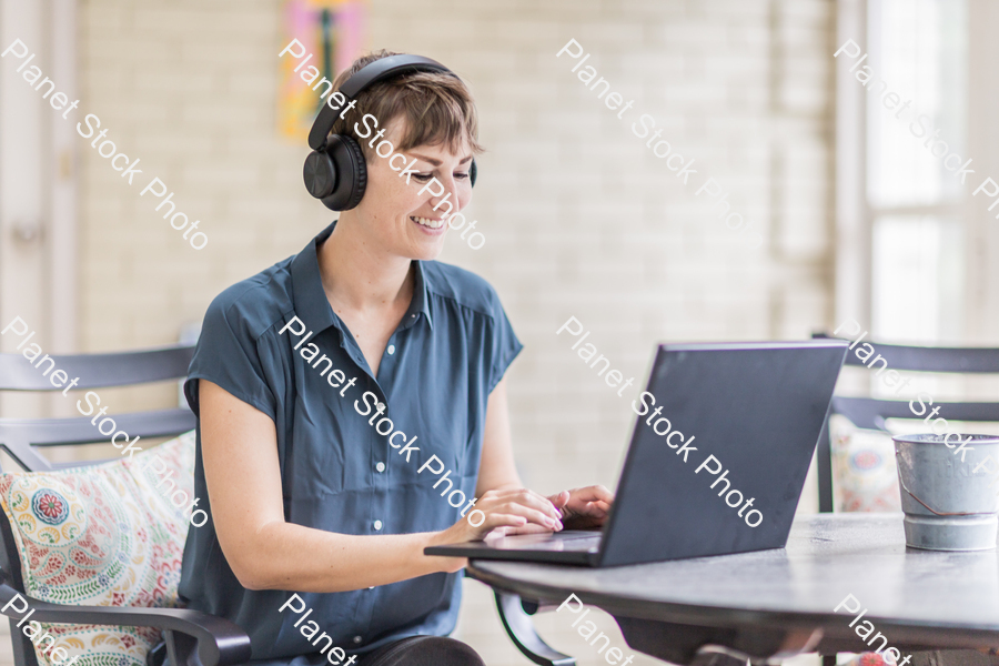 A young lady enjoying daylight at home stock photo with image ID: 7e3ce94e-86de-4826-9283-aebabece0394