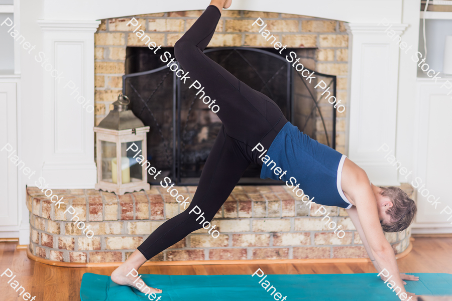 A young lady working out at home stock photo with image ID: 804563d5-f284-4b02-bdc9-75c80bdf1fc9