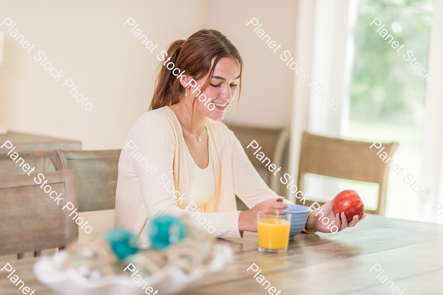 A young lady having a healthy breakfast stock photo with image ID: 815e4d83-a616-4f29-9bb3-40c611c34a00