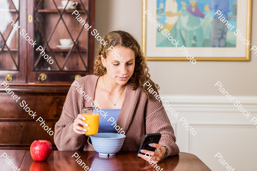 A young lady having a healthy breakfast stock photo with image ID: 81f0bee4-9213-48be-a649-8740c097f6da