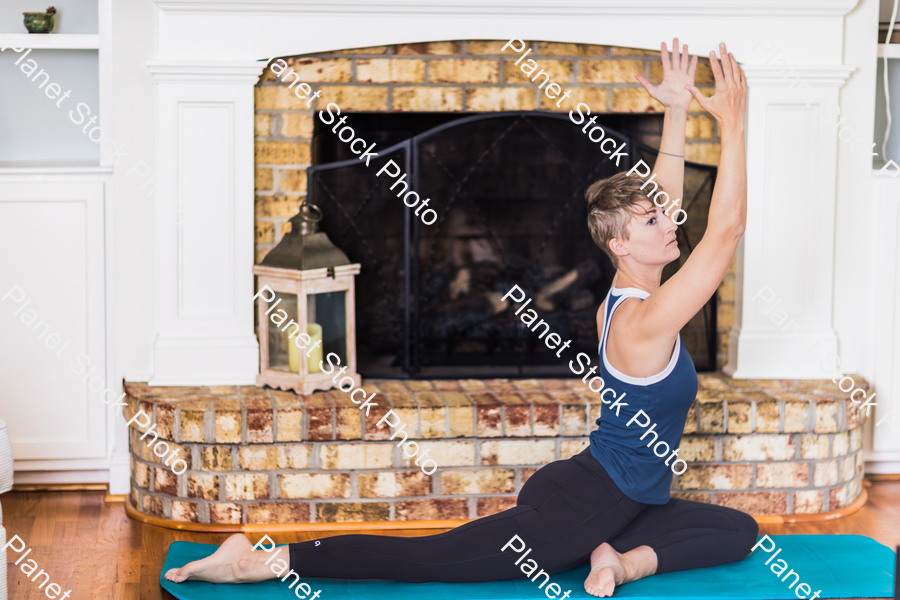 A young lady working out at home stock photo with image ID: 83673ff6-145c-43bf-8f8c-590b83eca9fd