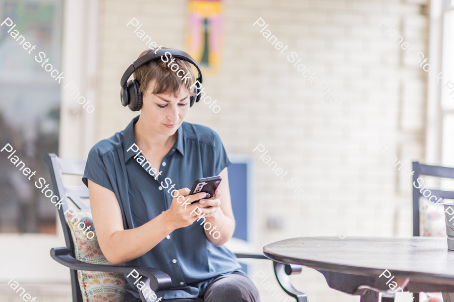 A young lady enjoying daylight at home stock photo with image ID: 838d9387-ddd9-4214-9cf5-0c4ce8a26f99