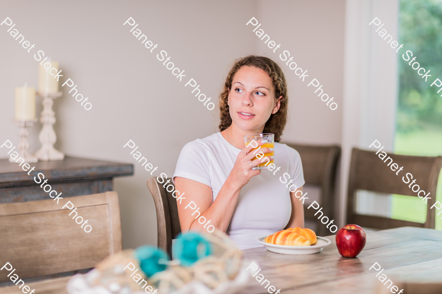 A young lady having a healthy breakfast stock photo with image ID: 84c7cd62-2903-485b-a577-4025447cb68e