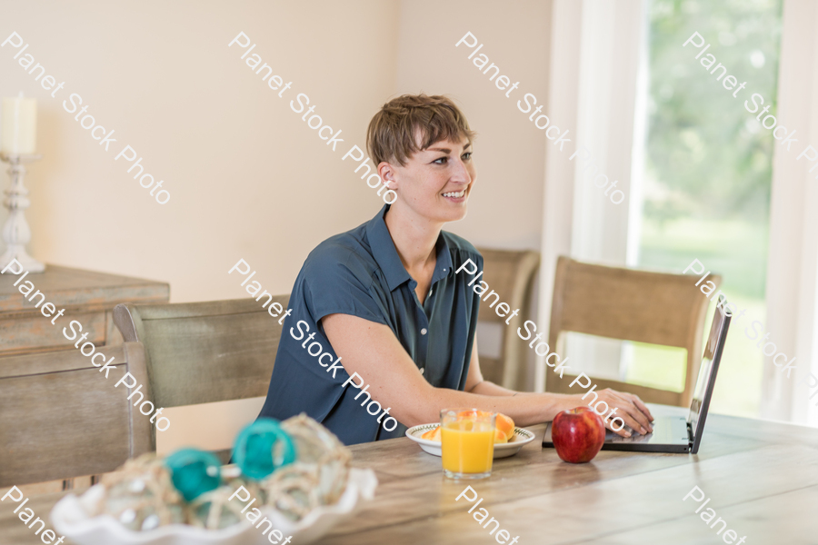 A young lady having a healthy breakfast stock photo with image ID: 84d10d42-6087-44c0-8fc1-9019095338e9