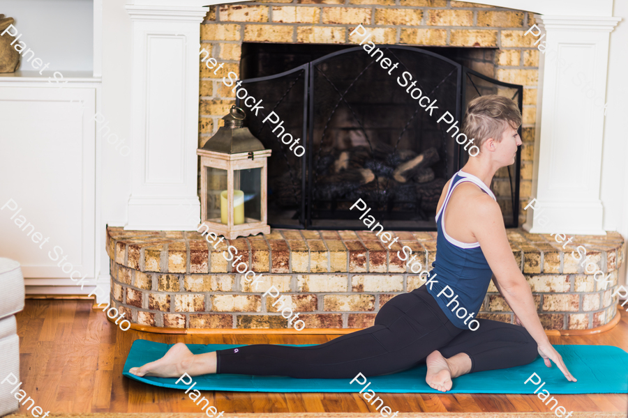 A young lady working out at home stock photo with image ID: 8663a4ef-5fbe-4a0c-922e-6fe57193493e