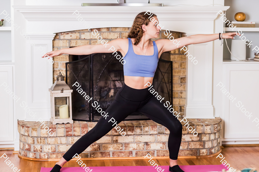 A young lady working out at home stock photo with image ID: 87336569-9adc-4f60-aad2-d47976d92095