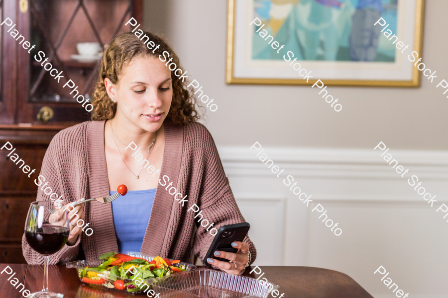 A young lady having a healthy meal stock photo with image ID: 87dc3d24-2dc0-4d49-90d7-98b914464653