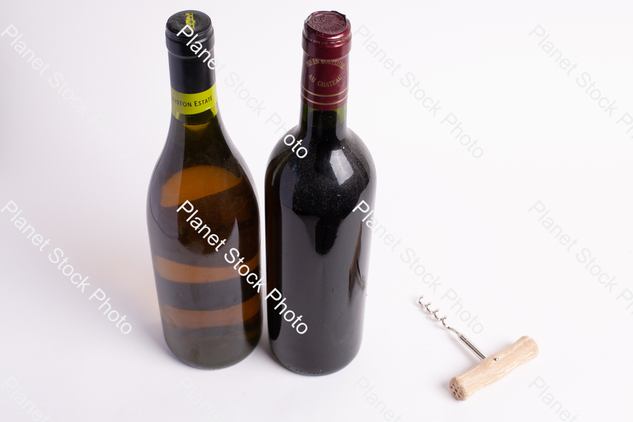 Two bottles of wine, with corkscrew stock photo with image ID: 88516e48-1f8e-49dc-a471-404467fad1e7