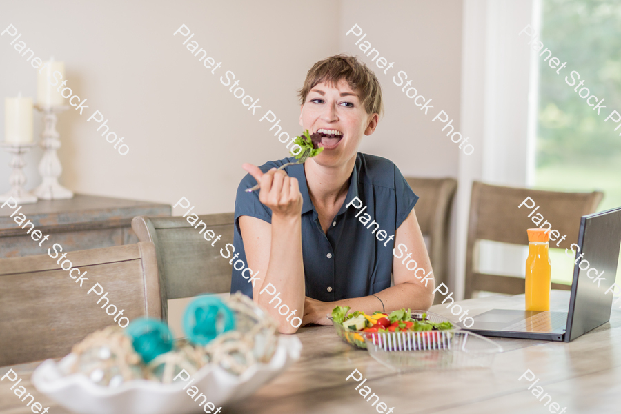 A young lady having a healthy meal stock photo with image ID: 885a0a8d-4bc3-415d-9c3e-760df9a51e7c