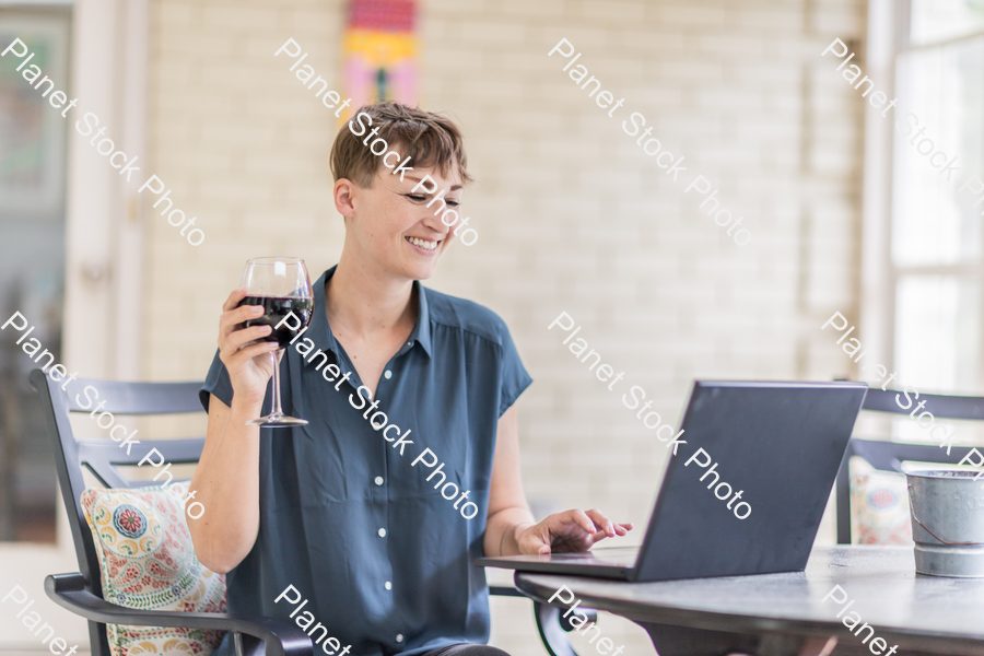 A young lady enjoying daylight at home stock photo with image ID: 8ab02856-acc4-4f5f-b396-81782f2d2448