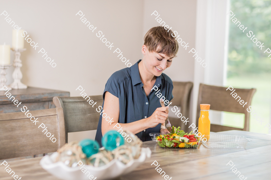 A young lady having a healthy meal stock photo with image ID: 8b445eee-28d0-4a37-bcba-5e0e6fd2e9ef