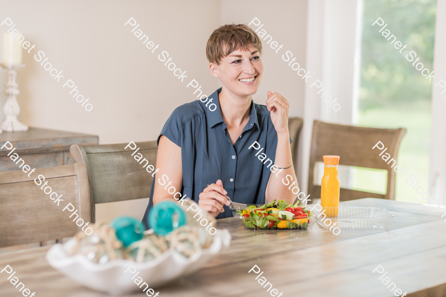 A young lady having a healthy meal stock photo with image ID: 8c02c752-29ba-4d7f-a57b-2f1001026d2d