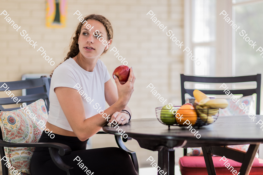 A young lady enjoying daylight at home stock photo with image ID: 8eb54d7a-86cc-40af-875f-40e82e8007ac