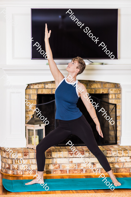 A young lady working out at home stock photo with image ID: 8fe1e911-88a2-4cdb-a7b3-494bf1fa41c0