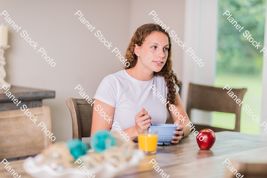 A young lady having a healthy breakfast stock photo with image ID: 914b11d7-4e68-4e7e-9e4c-859450e53bb7