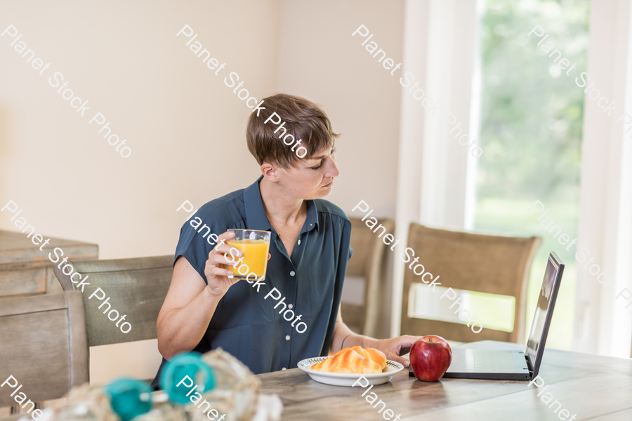 A young lady having a healthy breakfast stock photo with image ID: 92f8e775-2a32-4782-a674-09eea26519d9