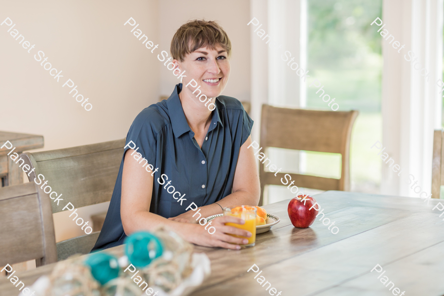 A young lady having a healthy breakfast stock photo with image ID: 92fb0118-4ae1-4256-a0c6-1e51b433373c