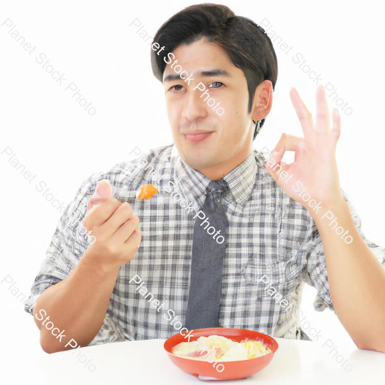 A Man Eating Food stock photo with image ID: 9463889a-0757-47a0-8e0f-6a31a6379a83