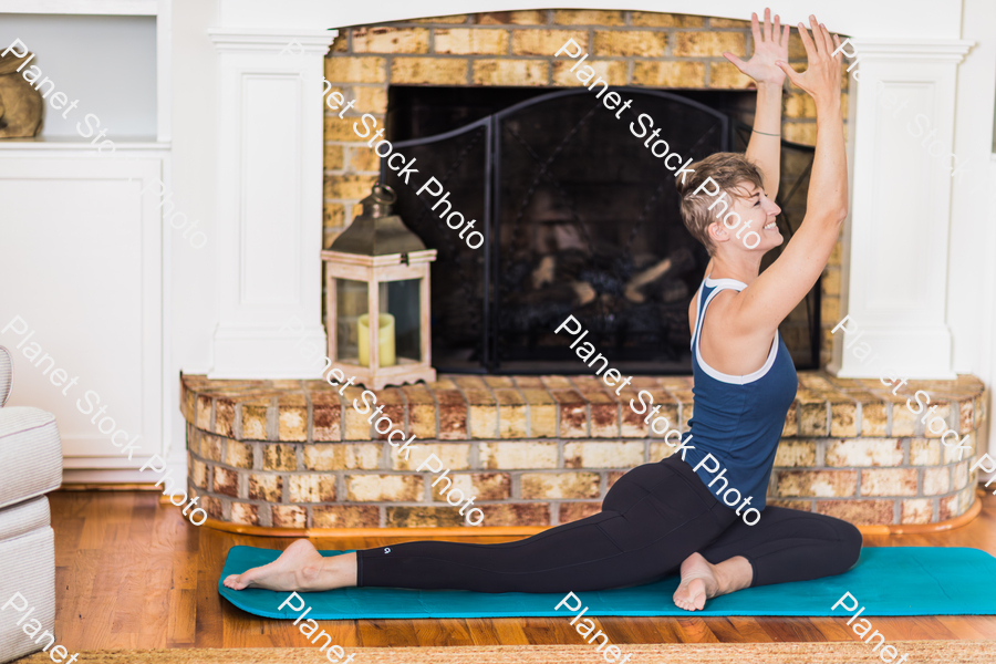 A young lady working out at home stock photo with image ID: 94c28009-3387-4ab6-943b-48e9356bd948