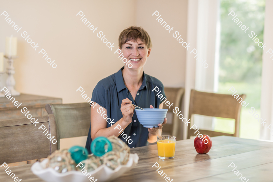 A young lady having a healthy breakfast stock photo with image ID: 94dcc988-af0f-4879-951e-98abcd11f129