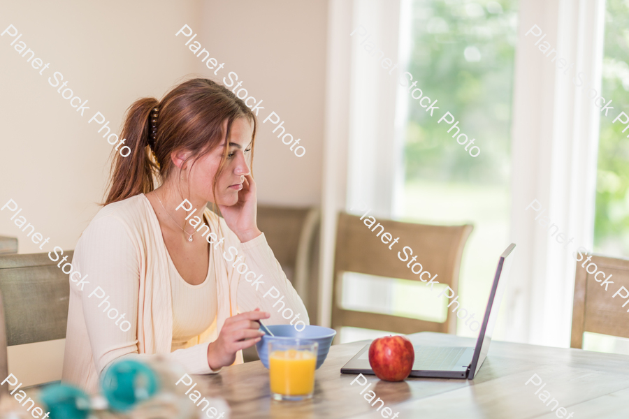 A young lady having a healthy breakfast stock photo with image ID: 959ba363-0328-4f2e-8e1b-504c4b40d980