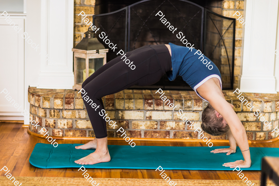 A young lady working out at home stock photo with image ID: 9659a5a9-417a-4fd0-8cf9-67d715ca0e14