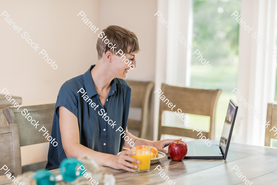 A young lady having a healthy breakfast stock photo with image ID: 968d97e8-c6dd-4d07-bc6e-e0124cd46588