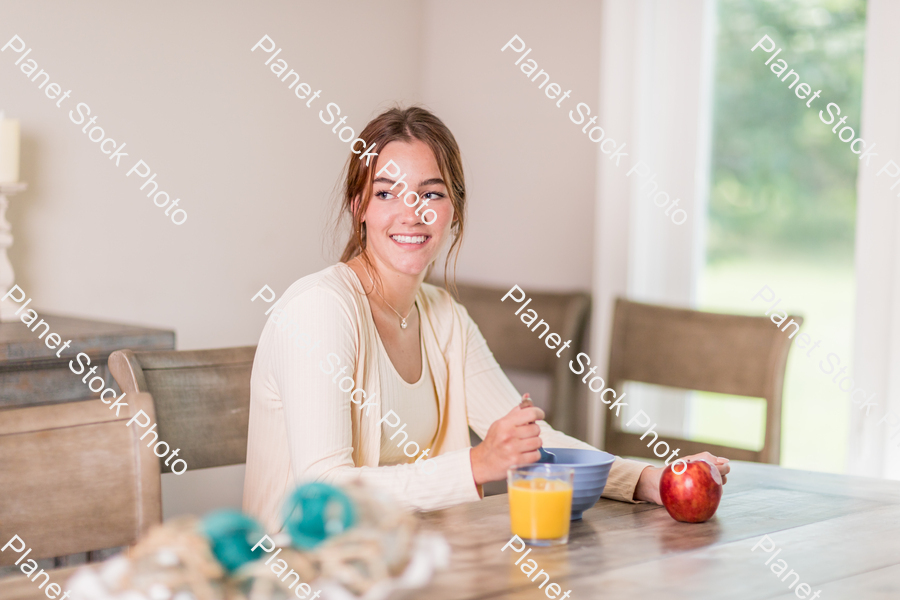 A young lady having a healthy breakfast stock photo with image ID: 969dd209-2a71-4eee-a14a-1e7a4a6dab82