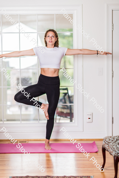 A young lady working out at home stock photo with image ID: 96a2df7c-56fc-4ebf-80f7-48c88d05aa1a