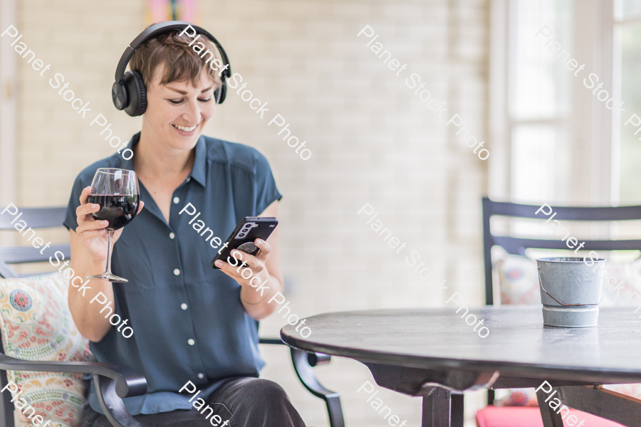 A young lady enjoying daylight at home stock photo with image ID: 97475690-1927-4c68-863f-dfaedd1b4fca