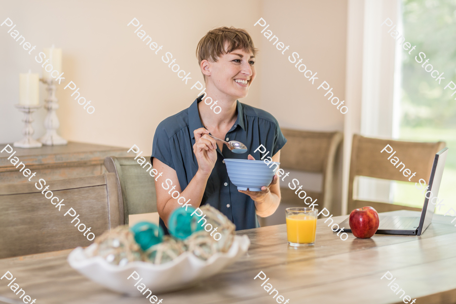 A young lady having a healthy breakfast stock photo with image ID: 99d44b9c-2184-484a-a8a6-42e102e08603
