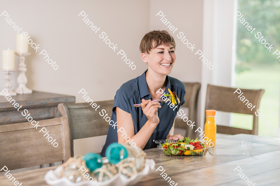 A young lady having a healthy meal stock photo with image ID: 9b7cb57c-6ee5-4a87-aa4b-87275e210b25