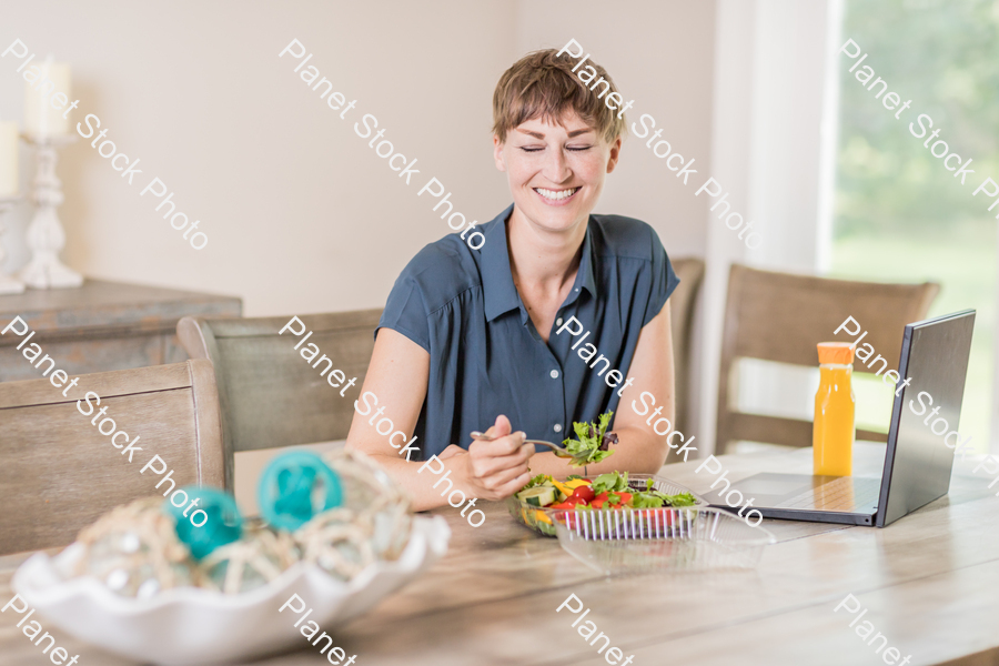 A young lady having a healthy meal stock photo with image ID: 9be90411-7707-4faf-822e-16fff18b6bf1