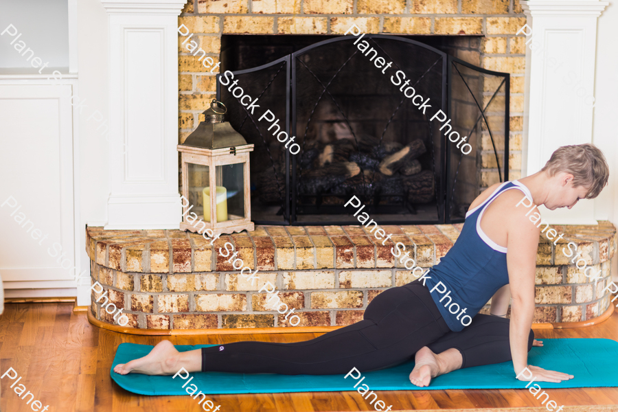 A young lady working out at home stock photo with image ID: 9c9de63f-4352-46df-97f3-0152a1f1e539
