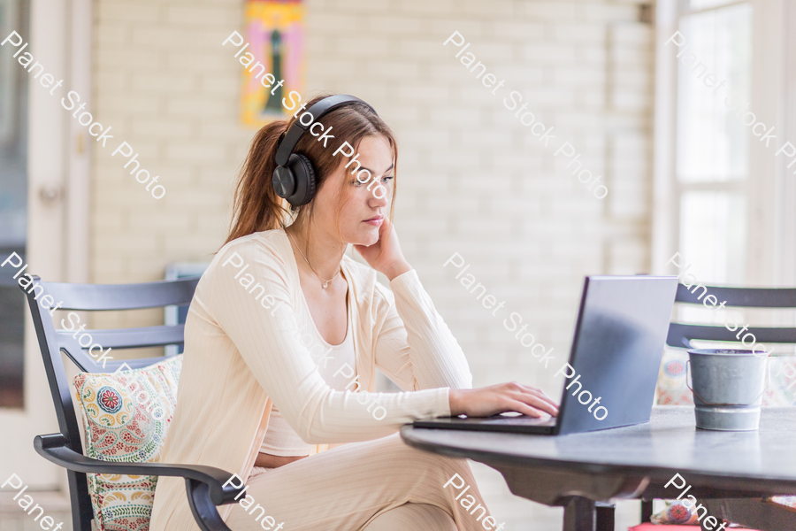 A young lady enjoying daylight at home stock photo with image ID: 9d220582-008d-4291-950b-4db9183e639d